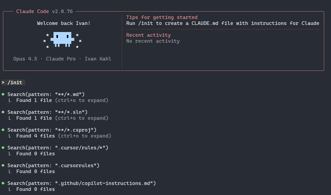 Claude Code terminal UI after running /init. The output shows a search for project files like .md, .sln, and .csproj.