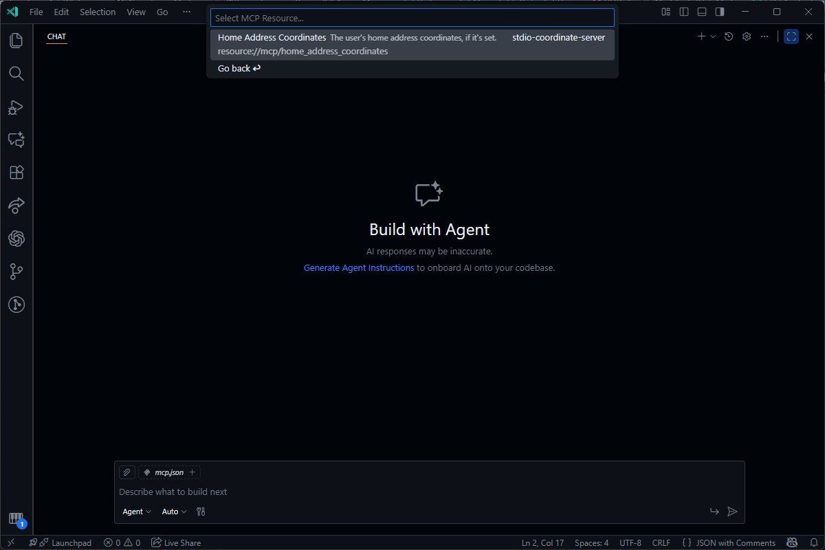 A code editor's AI chat interface with a 'Build with Agent' prompt and a dropdown to select a resource for the agent to use.